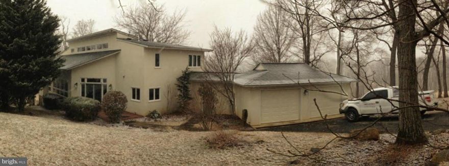 Open & bright contemporary home on 10 acres w/clear panoramic view of the Blue Ridge mountains. Elegant stucco exterior, warm mexican quarry tile floors, freshly remodeled kitchen w/granite counters, french country bisque cabinetry and stainless appliances. Refreshing and private inground pool. Fully finished basement. Wonderful rear porch with scraped wideplank flooring and wrought iron railings.