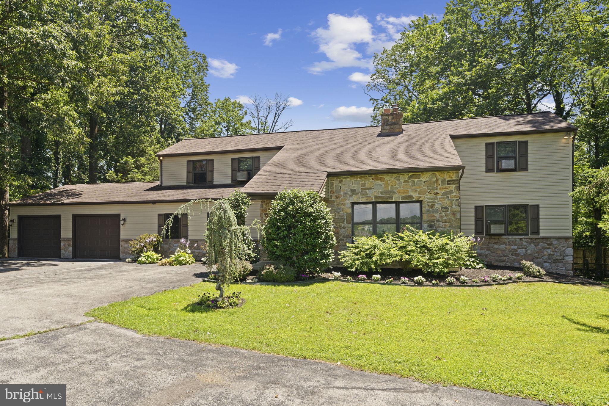 Welcome to this Beautiful contemporary-style home situated on a private lot with unobstructed views of preserved land that can never be built on, offering a rare opportunity to enjoy natural beauty and lasting privacy. This 1st floor primary bedroom and bath with oversized 2 car garage with circular driveway is perfect home for people who love to garden. Walking into this home you are greeted by the main focal point, a stone double sided fireplace, hard wood floors and a vaulted ceiling with exposed beams with an open floor plan. There are 2 sliding glass doors which both lead to the large deck that overlooks the in-ground pool and a view of all the gardens. On the main floor there is the large primary bedroom with laundry room and beautiful primary bath with free standing tub with stone surround and walk in shower! The gleaming hardwood floors flow throughout the main living areas, enhancing the home's clean lines and open feel. Upstairs in the center of the home at the top of the steps is a great hang out area or open feel office and 3 good size bedroom and 2 full baths! This home has newer roof, stone front and nice gardens. Very private homes that gives you the feel of country living on a dead end street