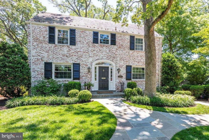 The home you’ve been dreaming about in the heart of Beverly Hills is waiting for you! Whitewashed brick with gas lanterns and a brick driveway welcome you to this stunning 5 bedroom/5 full bath colonial that is beautifully updated and move-in ready. Enter into the foyer and head to the main level bedroom/office on the left that can double as a great work from home office or cozy den, complete with full ensuite bath featuring gorgeous sconces and custom Hermes equestrian wallpaper. To the right of the foyer, the spacious living room is perfect for entertaining with a gas fireplace and built-in speakers. Beautiful crown molding accentuates this space along with rich, dark hardwood floors. The living room flows easily into the light-filled sunroom and kitchen where huge floor to ceiling windows overlook the treetops and provide an airy feeling and total privacy. The sunroom features a beautiful wainscoting ceiling. The well-appointed kitchen is light and bright and features stainless appliances including a new Sub-Zero refrigerator, new Miele dishwasher, two gorgeous Colleen and Company lanterns above the island, soapstone counters, white shaker-style cabinets with acrylic and gold cabinet pulls, and a coffered ceiling. Off the kitchen is an amazing custom butler's pantry with wet bar and wine refrigerator, and cabinetry and drawers for storage. The dining room has beautiful trim work and flows easily into the kitchen and living rooms - ideal for entertaining. There are three bedrooms and three full bathrooms on the upper floor, and a convenient laundry with new washer/dryer. Each bathroom has marble floors and tiling and updated fixtures. The master bath is a spa-like retreat with custom lighting and marble tiling. The master bedroom is spacious and bright, with huge picture windows, vaulted ceilings, large walk-in closet, and a beautiful chandelier. On the finished lower level is a fifth bedroom and full bath, utility and additional laundry area with new washer/dryer, a mudroom/storage room with side entry, and a spacious family room that walks out through french doors to a covered bluestone patio – a great space for relaxing. The lush backyard is terraced with an open area for playing and enjoying relaxing evenings under the stars, and improve your golf game on the new putting green in the side yard! Special highlights of this home include a whole house generator for peace of mind in any weather, dual zone heat/ac, large floor to ceiling windows, and so much more. Move-in ready and waiting for you to enjoy living on a cul-de-sac in the heart of Beverly Hills! Just a short walk to "The Pit" park and an easy commute to DC - welcome home!