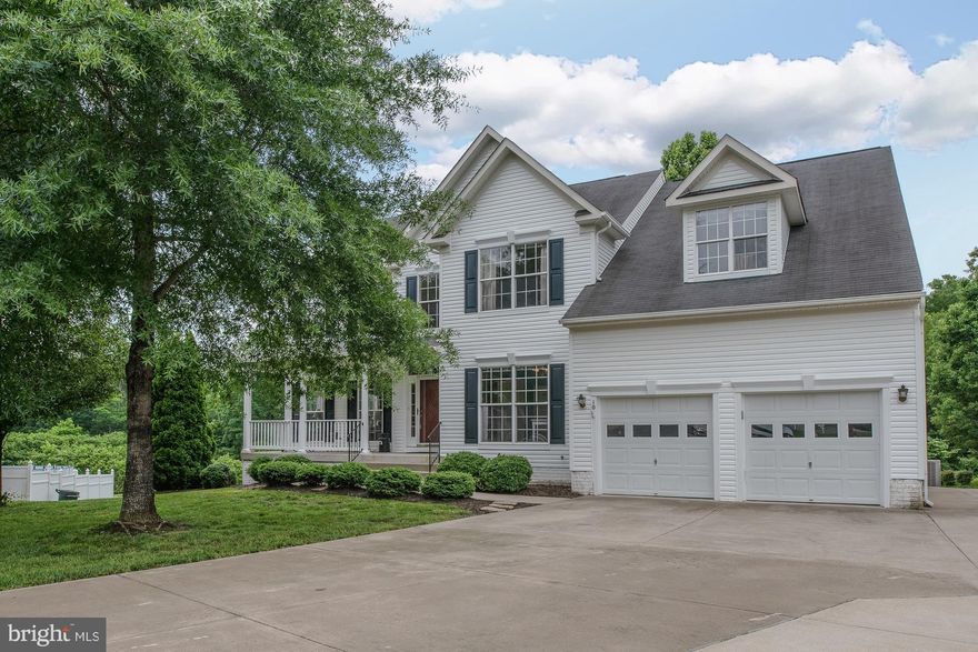 HUGE PRICE REDUCTION!  Welcome home to Luxury! Stunning kitchen with sparkling granite and over sized island.Sky high ceilings throughout foyer and family room with NEW hardwood floors.GIANT Master bed w/ beautifully tiled bath and HUGE walk in closet.  Basement w/ game and wired media room, wet bar, legal 5th bedroom and full bath. HUGE garage! Enjoy covered deck with water views. Priced to Sell!