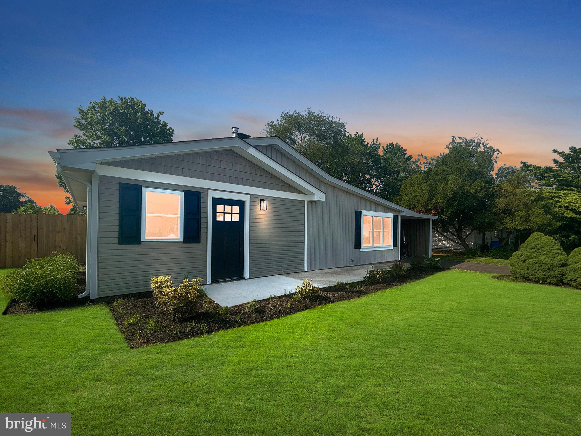 Completely Remodeled Rancher in Pinewood! Gorgeous renovation with 3 Bedroom, 2 Full Bathroom and completely fenced in yard! This home features striking Modern Kitchen with beveled subway tiled backsplash, white cabinetry, granite countertops, double sink, and stainless appliances! Brand new light laminate flooring are featured throughout this home! Large living room complimented with wainscoting accent walls, modern electric fireplace and neighboring glass door leading to the side yard! Main bedroom features walk-in closet and allows access to full main bathroom with massive tiled shower, new white vanity, toilet and modern fixtures! Two additional bedrooms are featured with nice size closets and a second full bath with modern tiled tub and shower surround, new white vanity and fixtures! Separate laundry closet is featured down the hallway close to third bedroom and there is also a large storage room adjacent to the covered carport! Newly fenced in yard features large exterior shed - ideal for added storage! Home has new heat pump, hot water heater, new roof, electric panel, and also new siding! All there is to do is unpack your bags! Home is ideally located in Pennsbury School District, minutes to all major throughways such as Route 1 and 295 corridors & nearby shopping & restaurants!