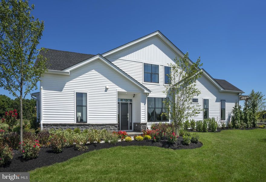 55+ Luxury Community. FIRST FLOOR PRIMARY BEDROOM SUITE! Quick-Move-In Homesite lot 217 will be ready for you late Spring of 2022! This COVERDALE MODERN FARMHOUSE floorplan offers an expanded, first floor primary bedroom suite featuring tray ceiling & fully tiled  OVERSIZED bath retreat. At 2073SF this home also showcases 9 ft. ceilings throughout the first floor plus a raised 11' high ceiling in the expanded Great Room. Enjoy upgraded interior finishes including  wide plank hardwood in the main living space. The kitchen is light and airy with tall windows and features SS appliances, 42" white cabinetry with contrasting island cabinetry in pewter, quartz countertops, & beveled back splash. Plus, there is a Loft for even more space and storage! Walk to your new, private, community clubhouse with 5,700 square feet of indoor recreation space plus outdoor swimming pool, bocce ball courts, pickleball courts, putting green, and more! Low-maintenance lifestyle that includes lawn care, landscaping, trash & snow removal. *Decorated model photos for representation.