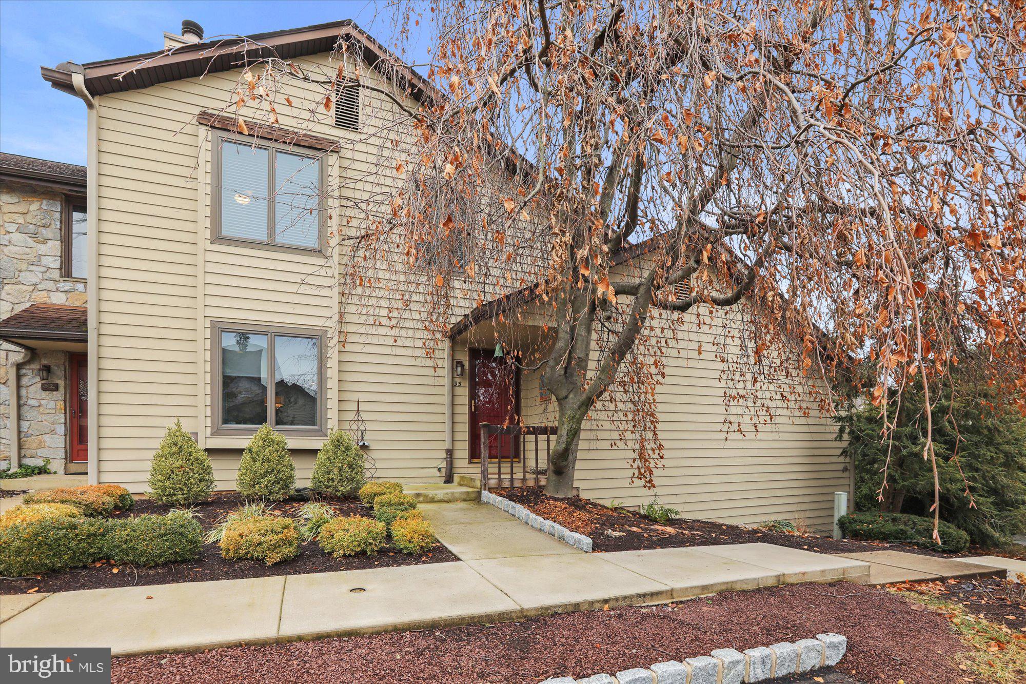 Updated and freshly painted! Welcome home to this beautiful 3 bedroom, 2.5 bath end unit townhouse in New Hope! As you enter the foyer, an abundance of light gleams off of the hardwood floors throughout the first floor, showcasing the spacious and open floor plan and the dramatic spiral staircase. The sunken living room focuses on a lovely wood burning fireplace with a detailed wooden mantle. Step up to the large formal dining room for easy entertaining. The spacious kitchen with white cabinetry and stainless steel appliances offers plenty of counter and cabinet space and a delicious center island for the gourmet chef. Adjacent to the kitchen is a welcoming family room. A newly updated and convenient powder room is also located on the main level. Stroll through the sliding door onto the spacious deck to unwind and enjoy the outdoors. Once back inside, ascend the gorgeous spiral staircase to the three bedrooms, full hall bath, and laundry area. Marvel at the impressive primary bedroom with a sitting area, large walk-in closet and sliding custom doors to the en-suite bath with a shower and tile flooring. The second and third bedrooms are generously sized and have ample closet space. The newly updated full hall bath and laundry room complete the second level. This townhouse also offers a full basement with plenty of storage. The garage is adjacent to the townhouse with an outside entrance. Community amenities include tennis courts and a pool. Just minutes to the historic & charming towns of New Hope and Lambertville along the Delaware River offering shopping, galleries, restaurants, and entertainment. Come see this beautiful townhouse and let it welcome you home.