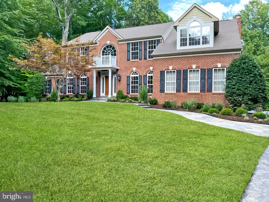 OPEN HOUSES--Wed, Thurs, & Fri 4 pm to 6 pm, and Sat & Sun 1 pm to 3 pm!! The elegant tone of this one-owner classic colonial on a private lush 5 acre wooded setting is striking as one drives up towards the home from the pavered driveway apron with custom mosaic inlay anchored with brick columns and copper lanterns. The meticulously maintained and extensive landscaping welcomes with the verdant expanse of the front yard. The owners invested over $220k in landscaping, including massive fieldstone boulders, 17 zone irrigation system, and exterior lighting. Upon entry, the vaulted ceilings reflect the airiness and spaciousness that invites one to come further in, with palladian windows providing perfect framing of nature’s wooded bounty outside, and allowing natural light to flood every corner of the home. From the formal dining room, meander to the home chef’s delight, a kitchen completely renovated in 2021. The kitchen is very open and bright from an oversized skylight that shows to perfection its granite topped island and counters nestled in crisp white cabinetry with gleaming stainless steel appliances that includes a beverage fridge and double wall ovens right by the breakfast nook. For al fresco dining and entertaining, spend it on the Trex deck with dusk to dawn lighting. In the family room anchored by the stone-accented fireplace for cozy evenings by the fire and the main level library, behold the beauty of custom cherry cabinetry built-ins. The home includes over $100k in custom cabinetry.  The primary bedroom with more vaulted ceilings and palladian windows, generously sized walk-in closets and bright, spa-inspired primary bath with a massive skylight is a sumptuous space for rest and restoration. The remainder of the upstairs includes three additional bedrooms and two full baths (including two bedrooms joined by a Jack and Jill bath). There is more to appreciate in the walkout lower level such as the media room and workspace with custom cabinetry, recreational area with large bar area with granite countertops, a dishwasher, fridge/icemaker, and microwave, a potential 5th bedroom or workout room and large, glass-enclosed steam shower in the 4th full bath with decorative tile mosaic. To get to call this gracious colonial home is a blessing but to have it in such close proximity to major traffic arteries as I-95, the Fairfax County Parkway, and Route 123, and having accessibility to a multitude of shopping and dining and entertaining options makes it even more so. Having Fountainhead Park and Burke Lake Park just a few miles away provides even more opportunity to enjoy the wondrous outdoor living of boating and fishing and hiking! Homes like this one is an opportunity to make a dream a reality … make it happen for you!