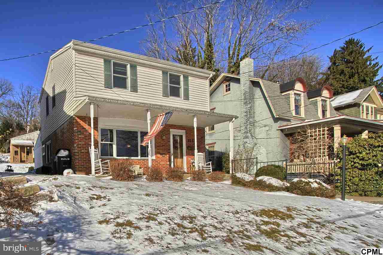 Beautiful traditional with a breathtaking open floor plan. Home boasts remodeled kitchen, and economical gas heat. First floor also includes a nice living room with hardwoods and brick fireplace as well as a spacious and cozy family room. For entertaining plus 1/2 bath. Recent improvements include a new gas furnace & front window. Deep lot with rear alley. Access to a detached 2 car garage. Super economical utilities.