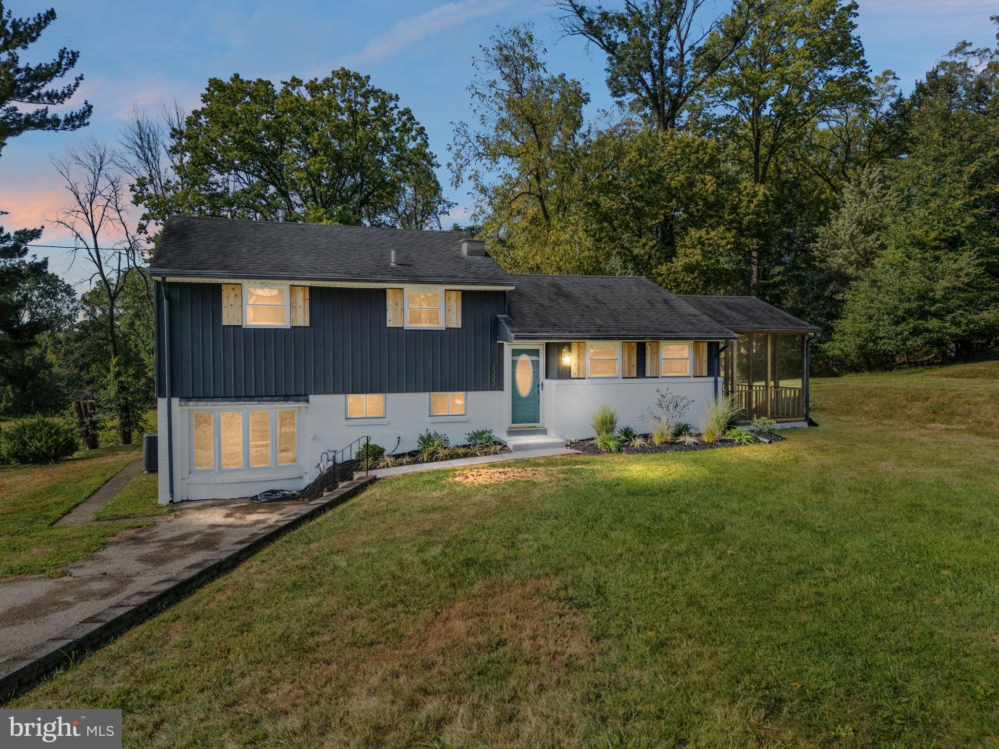 Welcome to 2327 Hillside Drive, a beautifully reimagined split-level contemporary home nestled in the heart of West Norriton’s sought-after Betzwood neighborhood. This three-bedroom, two-bath property offers a perfect blend of modern sophistication and functional design, set on nearly half an acre of newly landscaped grounds with droubt resistant plantings, a shed, and plenty of yard space for relaxation or play. The home features a covered, screened-in sunporch, an ideal spot for enjoying a morning coffee or winding down in the evening. Step inside to find a light-filled main level with an open-concept layout that connects the kitchen and dining area.The space is outfitted with luxury vinyl plank flooring, recessed lighting, and a thoughtfully designed kitchen featuring granite countertops, a built-in microwave, gas stove, dishwasher, and disposal. The clean lines and neutral finishes create a welcoming atmosphere that’s perfect for both everyday living and entertaining. Downstairs, the lower level has been transformed into a warm and inviting family room anchored by a wood-burning fireplace. This level also includes a full bathroom with custom tile shower, tiled floors, and an integrated laundry area. Whether used as a second living space, guest suite, or media room, this floor offers excellent flexibility. Upstairs, you’ll find three well-appointed bedrooms, each featuring vinyl plank flooring and upgraded closet lighting. The main bedroom includes direct access to the hall bath, which has been fully renovated with custom tilework, a Bluetooth speaker system, and a tub/shower combo that adds both luxury and convenience. A barn-style door leads into the primary closet, offering a modern twist on classic functionality. Behind the scenes, the home runs on a new 200 AMP electrical service, features all new mechanicals including a new gas forced hot air system with central air conditioning. With a location just minutes from major routes (422, 76, and 202), The Norristown Transportation Center, Valley Forge National Park and King of Prussia featuring a wide variety of dining, shopping, and entertainment.