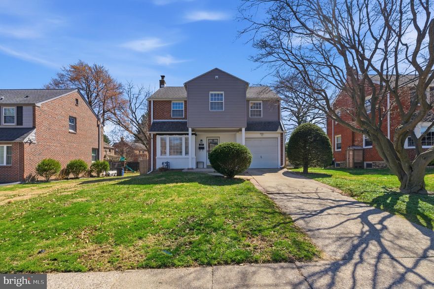 Woodmere's finest!  This recently renovated 4 bedroom, 2 full bath home has been in the same family since it was built!!  The current owner decided to renovate the family home in 2021/2022 and you'll love everything that's been done!  This completely turn key home greets you with it's private driveway, classic curb appeal and tree lined street.  The first floor has original oak hardwood floors finished in a medium brown matte finish- they are gorgeous and set the stage for all decor styles.  The large living room is filled with natural light from the bay window and has space for plenty of larger furniture.  The living room opens right up to the dining room, also large enough for a big table and server.  The eat-in kitchen was renovated in 2021 with the most modern and sleek finishes.  Modern cabinetry with crown molding, recessed lighting, quartz countertops modern subway tile backsplash and flooring, stainless steel appliances to include a gas range a door leading to the large and level backyard.  Upstairs you'll find 4 bedrooms to include a primary suite with stunning full bath.  The carpeting on the 2nd floor is just a few years old and still like new.  The 4th bedroom is being used as a large laundry room but it can be converted back to a bedroom in a flash!  The hall bath was also completely renovated and top of the line.  The basement was partially finished with a modern vinyl floor, drywall and lighting.  The utilities and 2nd set of washer and dryer is separate for convenience.  The finished space is great for an office, playroom or guest space.  This entire home is so fresh and ready to go and leaves just enough space for your spin!  The whole home has neutral and fresh paint and is ready to move into.  The 1 car attached garage is a great bonus, private driveway parking and level backyard.  The location of this home cannot be beat if you enjoy walking to parks, schools, grabbing a nice lunch or dinner out (or a cup of coffee!).  Take advantage of this incredible opportunity and truly loved and move in ready home! Showings start Thursday 3/26th!