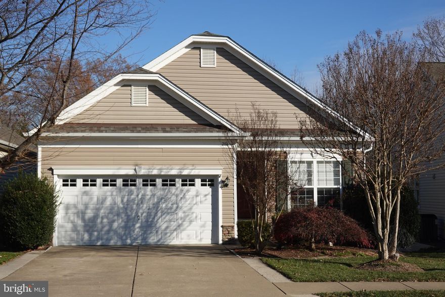 A rare opportunity for expanded York model on a premium walk-out homesite backing to wooded common ground. An open floorplan with the kitchen overlooking the great room, which has a gas fireplace, ceiling fan beautiful decorative trim and crown moldings . An addition off the breakfast area features tons of windows and a cathedral ceiling. It is currently furnished as a formal dining room but could be used as a sunroom. At the front, off the entry is a Bedroom/Office. The lower level (L/L) matches much of the first floor. The L/L great room has a second  gas fireplace. The spacious L/L bedroom features a sitting room and direct access into the L/L bath. The L/L "hobby room"  can also be used as an office or additional storage (in addition to the unfinished area storage).    A deck with stairs overlooks the trees and leads to a lower level stamped concrete patio.  The yard has been professionally landscaped. New roof in 2021.

You will enjoy Falls Run, an active Over 55 Adult community with an Award Winning Clubhouse, Indoor and Outdoor Pools, Spa, Tennis, Pickleball, Bocce, Fitness Center, Billiard Room, Card Room,  and Table Tennis. On Site Concierge, General Manager, and Activities Director. Over 50 Activities each week!