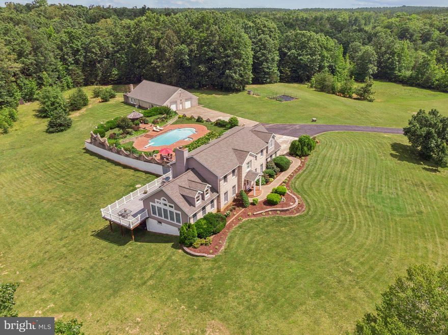 **Private Estate on 50 Acres with Pond, Guest Apartment & Out Building/Workshop **

Welcome to your private retreat! Tucked behind an electric gate and accessed by a scenic paved driveway, this impressive 50-acre property offers privacy, luxury, and versatility like no other.  Close proximity to Fredericksburg, Stafford and Warrenton!

The **main residence** features:

* 5 spacious bedrooms and 4.5 bathrooms
* A full finished basement, ideal for entertaining or multi-generational living
* Attached 2-car garage
* Tyvek decking with stunning views of the surrounding landscape
* A beautiful **in-ground pool with lanai and gazebo**, perfect for outdoor living and summer gatherings

The **detached guest apartment** offers even more space and functionality:

* 2 bedrooms, a full kitchen, and a full bath
* Attached 2-car garage with additional room for lawn equipment, storage, or a workshop
* **A smokehouse attached to the garage apartment**, perfect for hobbyists or those who enjoy home smoking and curing

Across the picturesque **3-acre pond**, stocked with crappie , bluegill and bass, you'll find a massive **outbuilding** with:

* Oversized garage bay large enough to accommodate a tractor trailer
* Finished office space and abundant storage
* A framed and roughed-in upper level for future living quarters — layout includes kitchen, living area, bedrooms, and bathrooms (drywall not yet installed)

**Outdoor enthusiasts will love the hunting potential** — the wooded acreage with trails offers prime habitat for deer, turkey, and other wildlife, making it ideal for recreational use or managing your own private hunting grounds. Perfect for horse enthusiasts as well, plenty of space to build riding arena and stalls.

Significant updates include **new siding and roofs installed in 2021** on the main house, guest apartment, and outbuilding.

**Property is being sold as-is.** Overall, it’s in great shape with well-maintained systems and structures.

Whether you're looking for a family compound, a private getaway, or space for a home-based business or hobby, this exceptional property delivers it all. Schedule your private showing today and explore the possibilities this rare offering provides