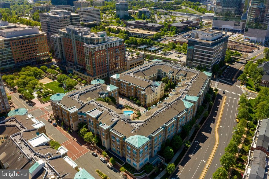 Rarely Available Model....A wonderful 3 bedroom/2 bath *CORNER* unit facing the courtyard with lovely views of the community pool at Market Street at Reston Town Center!  Bright & sunny with wall of windows--16 windows in fact! This condo is surely to please any prospective buyer. Gleaming hardwoods, open living/dining/kitchen layout is spacious and perfect for entertaining, custom built-ins convey & include living room entertainment center, dining room buffet, full master suite setup & 3rd bedroom is currently set up as a phenomenal home office!  The 2nd bedroom is spacious with a large walk-in.   Both walk-ins have custom organizers.  See the documents sections for list of upgrades which include the HVAC, water heater, windows,  washer, kitchen appliances & more.   2 *RESERVED*main level, side-by-side garage spaces conveniently located just steps from the elevator lobby & 2 STORAGE units convey with this unit!  This property was just freshly painted and has newly installed carpet!  Located at end of building for maximum privacy--its very easy to pop out onto Saint Francis Street to take a walk, walk your pet or enter the town center.  Wonderful community amenities --pool, newly upgraded onsite gym/exercise area, community/party room, beautifully renovated hallways, FOB entry, concierge & more.  WALK to all the Reston Town Center has to offer and the NEW METRO STOP at RTC is OPEN and just two blocks away.   The new Wegman's is a short drive, the W&OD Trail is nearby along with Dulles International Airport (you now have the option to take the Metro to the airport).  Could this property be the one?  Come see us!