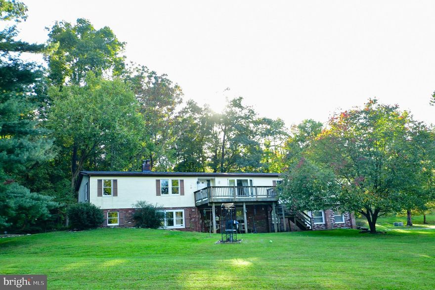 Welcome home to a one of a kind two unit home situated on 3 park like acres.  Nestled just outside of Sykesville, this home boasts 3 bedrooms, 2 full baths, kitchen, living room, family and laundry rooms, rough in for a pellet stove on upper level with a large deck.  The lower level has 3 bedrooms, 2 full baths, living room, eat in kitchen, wood stove and large patio.  Each unit with amazing views of green and trees abound.  Each level has two entrances/exits.  Large workshop with electric.  Parking for 12 or more cars.  Private lot with amazing possibilities for in-laws, college student or rent one while living in the other.  New flooring on upper level and fresh paint throughout.  Minutes to major commuter routes, restaurants and shopping.