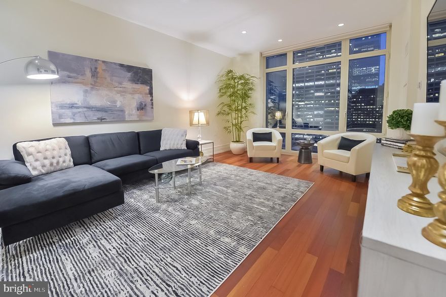 Fantastic opportunity to own a luxurious and spacious 2-bedroom, 2.5 bath unit at 10 Rittenhouse Square Condominium. This private residence is situated up high on the 21st floor and features rich Brazilian cherry hardwood floors throughout the entire layout, custom lighting and window shades, a large dine-in gourmet kitchen with Poggenpohl cabinets, Sub-zero refrigerator, Miele dishwasher, wall oven, and gas cooktop with exceptional storage and an oversized breakfast bar.  Each bedroom has its own full bath with white marble, generous custom built-out closets and gorgeous city skyline views which create a perfect setting for both entertaining and everyday living.  At 10 Rittenhouse, owners have full access to the wonderful amenities including a 24-hour concierge service & doorman, a chauffeured driven town car, Fitness center, Boardroom, Indoor Lap Pool, Wine Storage, Library, Catering Kitchen, Courtyard & More! Seller is including 5 full years of 1-car paid parking.  Schedule your private showing today!