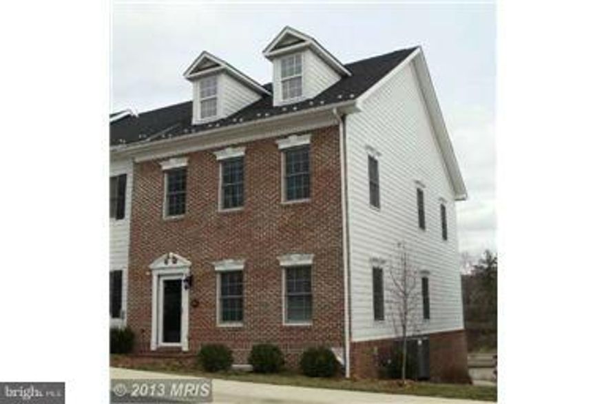 Beautiful end of group Carriage town home in a great location just a block from the center of Woodstock for shopping, restaurants & more make this an ideal location. Over 2,000 finished square feet of luxury living space with 3/4 bedrooms, 3.5 baths, hardwood flooring, granite countertops, cherry cabinets, 2 car garage & much more.