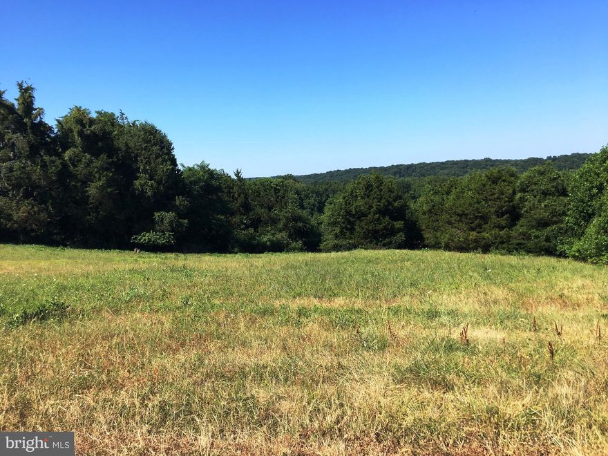 Approved building lot Well/Septic in upscale Locust Grove Community which overlooks the valley & Port Tobacco River. Perfect lot for walk out bsmt, build your dream home in a great community of other custom built homes where no 2 are alike.  Located just minutes from the marina, parks, recreation, dining.  Easy access to Rose Hill/Bumpy Oak to 210 for commuting. Recently appraised. No Covenants!