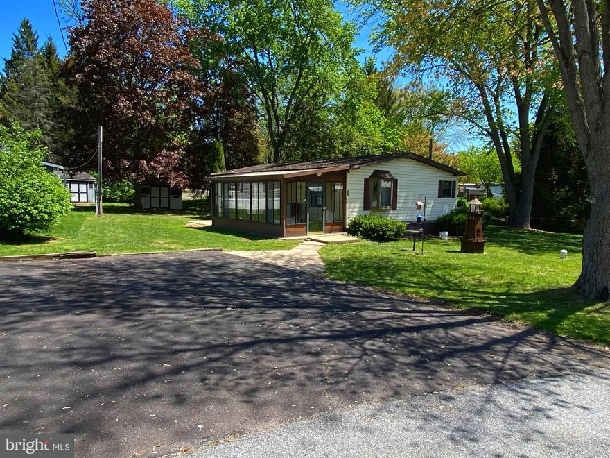 Welcome home to this spacious move in ready Double wide home located not only on one of the parks largest lots but is also conveniently tucked away on a quiet side street in the Coventry Terrace Mobile Home Park Community.  Coventry Terrace is located in Spring City and the very desirable Owen J Roberts School District.  13 Terrace Drive has so much to offer… from the enclosed front porch (Four Season Room) w/ heat & A/C, to the large covered rear deck.  The Kitchen and Livingroom combo provide a large amount of open space. Did I mention the kitchen offers a skylight to bring in more natural lighting.  The Primary Bedroom features a walk-in closet.  Bedroom 2 offers double closet space for ample storage. The Full Hall bath as well as a laundry room complete the living area.  The shed out back is equipped with electric & an exhaust fan.  When the Seller’s purchased in 2022, at that time they added New Flooring, a New Hot Water Heater, Washer/Dryer, Refrigerator, and updated Hall Bath also,  Updated Lighting through out.  They did at that time close off the Primary Bath however, all the plumbing has been capped off and is easily accessible to reconnect. (Please contact Listing Agent for more details)  Low taxes and $685 lot rent includes water, sewer & trash. Not to mention this affordable one floor living home is close to schools, shopping, and parks. And convenient to commuter routes such as Rt 724, Rt 100, Rt 113, Rt 422, and Rt 23. A terrific opportunity at home ownership. Call and schedule your tour today!