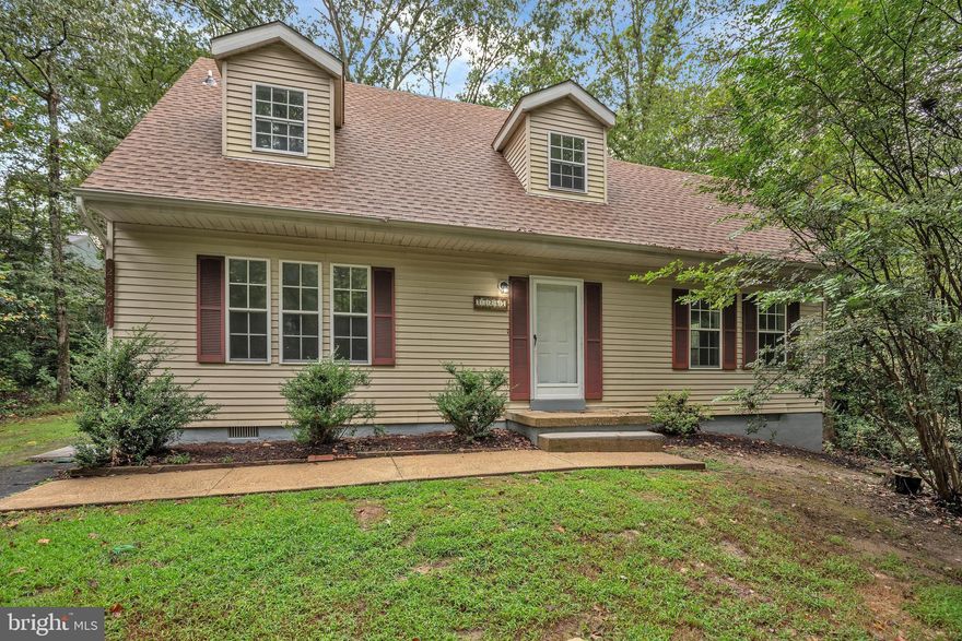 Welcome home to this charming Cape Cod nestled on a wooded lot. House has been renovated, all new kitchen, flooring, paint, and more. Main floor offers living room with fireplace, large kitchen with plenty of table space and a separate dining area. Dining room leads to screened in porch, perfect for entertaining. Laundry room, with an extra sink and cabinets, is located off the primary bedroom and has a rear entrance. Exterior renovations include a new roof, updated crawlspace and more. Neighborhood is full of amenities from walking trails to playgrounds, and a community pool with annual fee. Don't miss out, schedule your showing today!  To help visualize this home’s floorplan and to highlight its potential, virtual furnishings may have been added to photos found in this listing . Sold As Is.