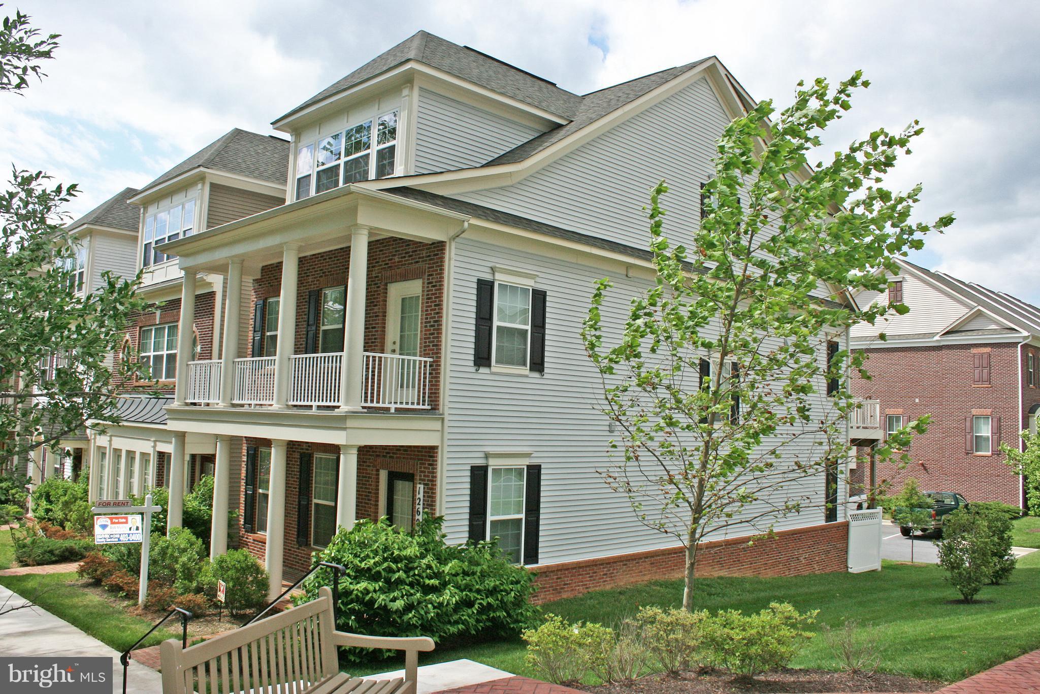 Large carriage house Semi-Detached End Unit Townhome, all 3 levels above ground. ***** Entry level includes a recreation room, legal bedroom, full bath, a wet bar and a large mud room with storage off of the attached garage. ***** Beautiful hardwood runs through the main level. Gourmet kitchen with island, breakfast bar. Gas fireplace in the family room. Large dining area in open floor plan. ***** Upstairs features a large owner suite, with ensuite luxury bath and a walk in closet with organizers. Laundry upstairs for your convenience. *****Enjoy nature from your synthetic deck, balcony and porch. **** Great location near 2 community pools, shopping center, bus line, and paved trail. ***** Pets on a case by case basis. No smoking. Security Deposit of One Month Rent. Available August 4. New carpet being installed.