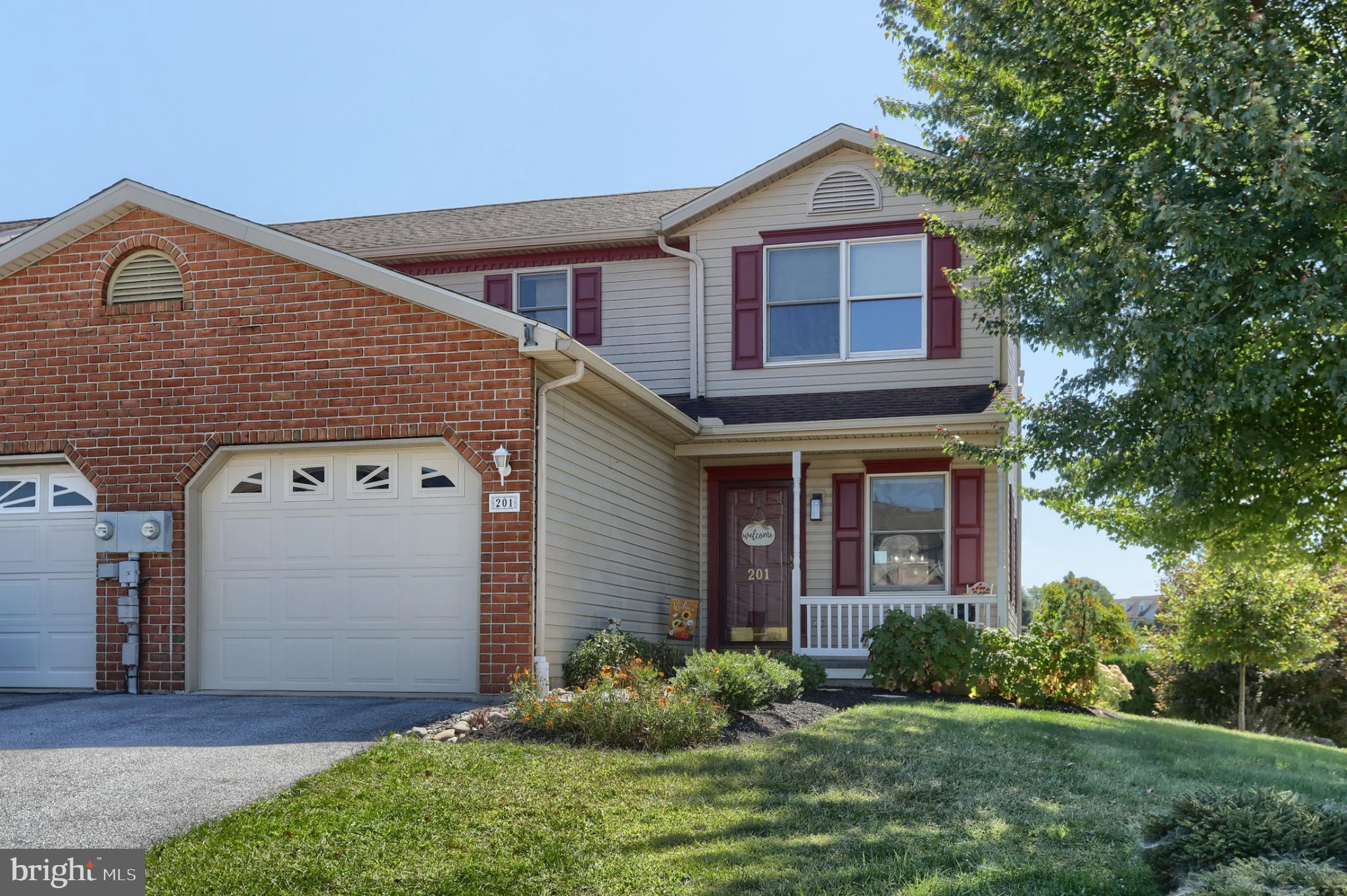 Beautiful End-Unit Townhouse on a Corner Lot! This meticulously maintained home lives like a single-family residence with abundant space and thoughtful updates. The first floor features a large, sun-filled living room, formal dining room, and a bright kitchen with breakfast bar and white cabinetry, plus a spacious mudroom/laundry area. Upstairs you’ll find two generous bedroom suites, each offering comfort and privacy. The finished lower level boasts a large family room with charming brick gas fireplace, a cozy office, and a utility room with storage units that remain. Enjoy year-round comfort with economical gas heat and hot water. Step outside to the brand-new screened-in porch with trek flooring, ceiling fan, and new patio door—perfect for relaxing or entertaining. Additional highlights include an abundance of storage space on every floor and the freedom of no HOA or association fees. Washer, Dryer and side by side Refrigerator stay. This move-in ready home is a rare find—don’t miss it!