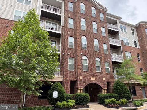 Photo of 13724 Neil Armstrong Avenue #404, HERNDON, VA 20171 (MLS # VAFX2322904)