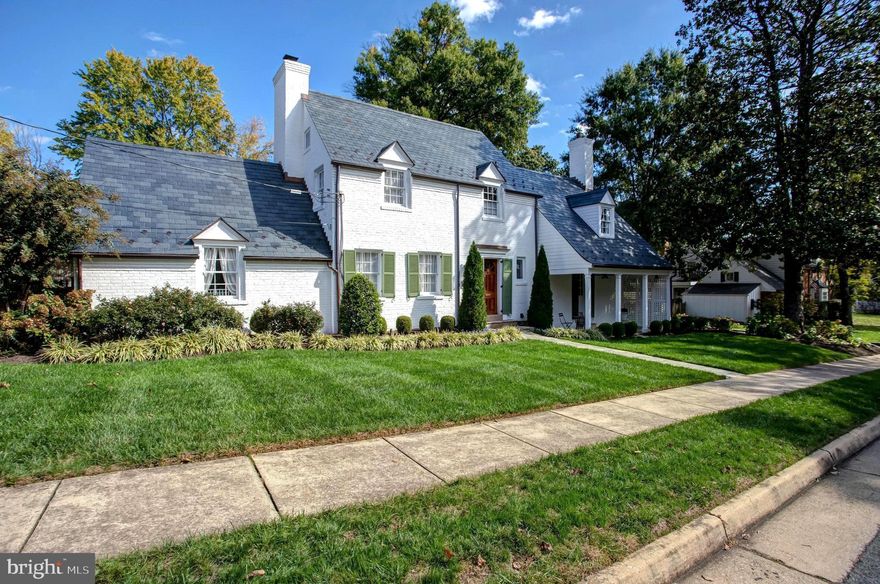Timeless character in sought-after Belle Haven! **** This classic fieldstone and brick colonial with charming cottage appeal is now on the market. From the newly installed slate roof with dormer detailing, the European-style front door, to the covered, flagstone side porch, the curb appeal of this home is stunning. **** Extensively renovated in 2019, this family-friendly home with a 2-car garage is move-in ready! **** The welcoming foyer leads to a spacious living room with fireplace and an expansive dining room with a door accessing a charming, covered flagstone side porch. With hardwood floors throughout, the main level also features an over-sized bedroom [currently in use as an art studio] and a well-appointed full bath. The gourmet kitchen, renovated with top-of-the-line appliances is well-equipped for entertaining. Adjacent to the kitchen, a breakfast bar/serving station is the perfect amenity for everyday living and for hosting guests. Directly off the kitchen, a rear door provides direct access to an inviting backyard retreat. **** Hardwood floors extend to the upper level which features a generously-sized Owner’s suite with private bath along with 2 additional bedrooms and a tastefully updated full bath. **** The home’s lower level has a spacious recreation room with laundry, an abundance of storage options and access to the two-car garage. **** The private, fenced backyard creates the perfect setting for relaxing on the spacious flagstone patio around the built-in fire pit or entertaining guests in the beautifully landscaped backyard. **** The location is unbeatable: Just minutes away from the Belle Haven Country Club and the Belle Haven Marina, Old Town Alexandria, the Pentagon and Reagan National Airport. This charming home at 1932 Summit Terrace has it all—convenient access to everything and a coveted private setting in the heart of the exclusive Belle Haven community.