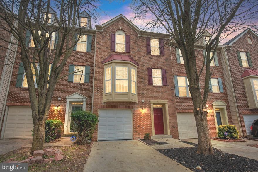 Exquisite 3 level brick townhouse in the heart of Bowie. This house has it all: 1 car garage plus driveway for plenty of parking, deck for all kinds of occasions all year around, spacious fenced backyard, hardwood floors throughout main level, upgrades include: freshly painted and new carpet. Close to all shopping needs and major highways. This home features a large living room with a fireplace, a dining room with a bay window, a kitchen with stainless steel appliances and granite countertops, and a powder room on the main level. The upper level has three bedrooms and two full bathrooms, including a main room with a walk-in closet and a private bathroom. The lower level has a family room with a den that can be used as an office or a guest room, a laundry room, and a storage room. Close to Metro, 495, Route 50, the recently built Regional Medical Center, and Woodmore Town Centre- which includes Costco, Wegmans Supermarket, shops, restaurants, and more. This townhouse is a must-see!