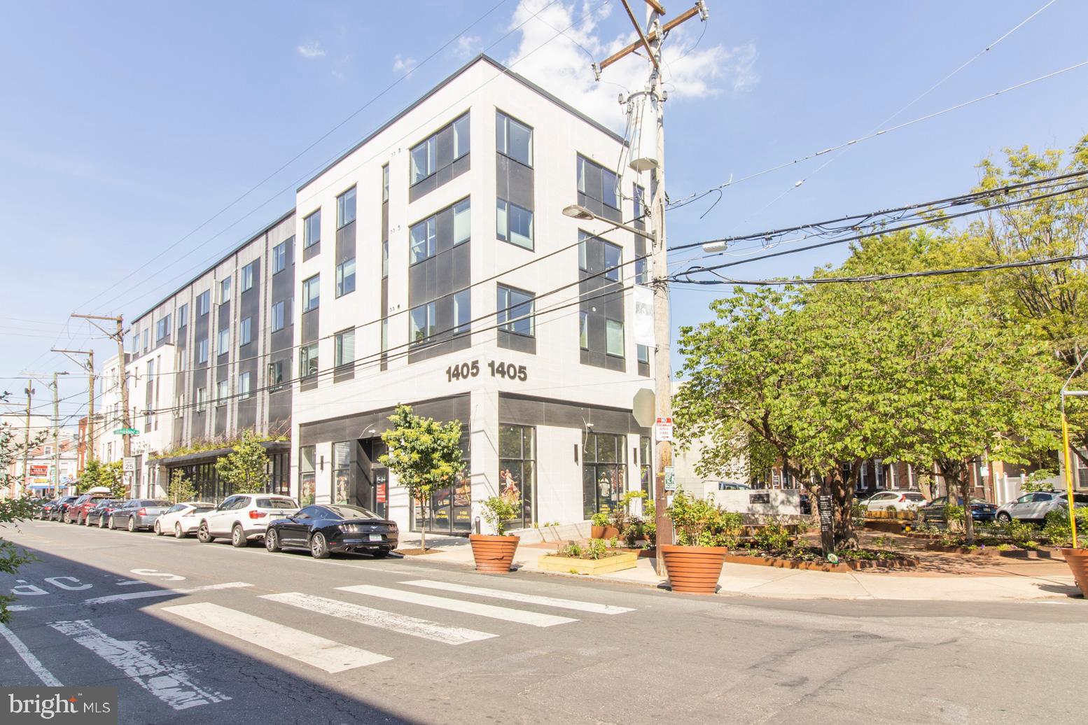 Welcome to this Gorgeous, sun dappled, 2 bed, 2 full bath condominium with deeded garage parking, 7.5+ years of tax abatement remaining and SPECTACULAR city views on the top floor of Penn Treaty Residences at 1405 Frankford Avenue. This Amazing condominium is located at the very heart of Prime Fishtown, Philadelphia's most dynamic, vibrant and sought-after neighborhood! Situated directly behind Fishtown's historic, and newly remodeled, Rose Garden, enter this barely 2.5 year old, 30 unit building and enjoy your urban oasis to the fullest. Entering #507 you will find rich, white oak flooring throughout, a convenient coat closet, then your first, oversized, full bathroom. Each spacious bedroom offers city views and large, carpenter built closets with the primary bedroom boasting an en suite ultra-modern designed bathroom with Italian tile flooring and wrap-around,oversized fully tiled shower and beautiful porcelain vanity. Down the hallway find an ideally located laundry closet on the way to your open concept kitchen/living room offering PANORAMIC center city views. Note the double thick quartz countertops , high end GE stainless steel appliances including a double wall oven, cooktop stove and French door refrigerator, complete with an electric fireplace This beautifully maintained building's amenities include a spacious common roof deck with spectacular 360 views including Center City and the Ben Franklin Bridge, deeded storage bins for each unit, bike room in the basement, secure key fob entry and of course an elevator. Mere steps from La Columbe, Suraya, WM Mulherin's & Sons,  Kensington Quarters, Ramona Susan's Bake Shop, Heffe Tacos, City Fitness gym and a myriad of other bars, restaurants, bakeries, souperies, specialty shops, nail salons, boutique clothiers and so much more. This is why Forbes magazine called Fishtown America's Hottest "New" Neighborhood in 2018 and it's only gotten better since. A 5 minute walk to the EL or multiple bus lines, easy access to I-76 & I-95, Walk & Bike Scores of 94 ("Paradise") so what are you waiting for? Make it yours today!