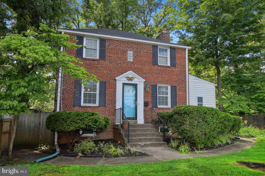 ADORABLE colonial very close to not one but TWO planned Purple Line Metro Stations! Solidly built all brick three bedroom, two bath home boasting ORIGINAL hardwood floors, large rooms, plenty of private off-street parking and a wonderful outdoor space for entertaining and just enjoying life.  WARM and INVITING with cozy , traditional spaces including a dining room.  Double pane replacement windows for energy efficiency and quietness.  Separate den on the main level perfect for working from home or studies.  Freshly painted and ready to go.  Newer roof!  Tastefully decorated and just waiting for your finishing touches.  Just north of Takoma Park and easily accessible to shopping, dining, and all the area has to offer.  Just blocks from Takoma Park and dining, etc.  Just across from the Giant and in a great Silver Spring neighborhood.