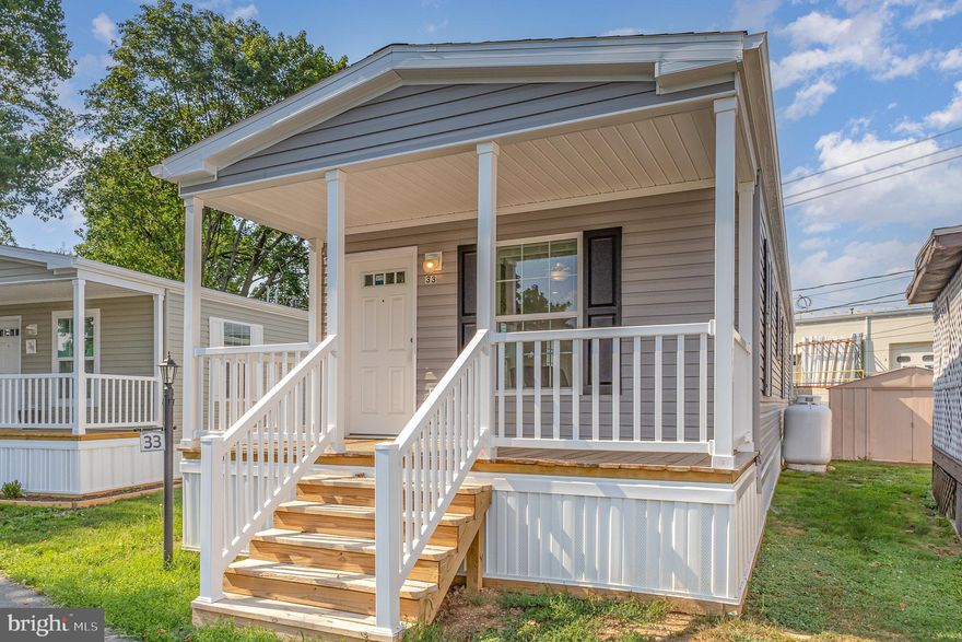 Like New!  This home was built in 2024 and  comes furnished with the items you see in the photos as well as a refrigerator AND a washer and dryer.  The open floor plan is perfect for entertaining.  Imagine yourself sipping your morning coffee on the spacious, covered front porch. You'll appreciate all that one floor living has to offer! Schedule your showing today!