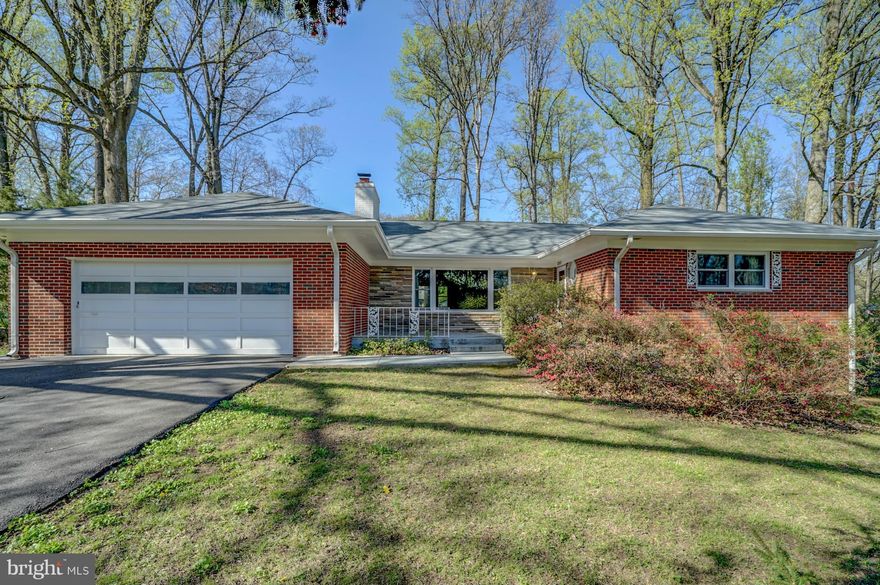 Well-maintained 4 bedroom/3 full bath rambler features brand new roof & gutters, new windows, refinished hardwood floors throughout main level, 2 custom stone fireplaces and an attached 2 car garage. Fresh paint through main level. Master bedroom has attached full bath. Large, flat yard with mature trees. Just minutes from 495, downtown Silver Spring, and Wheaton Metro Station!