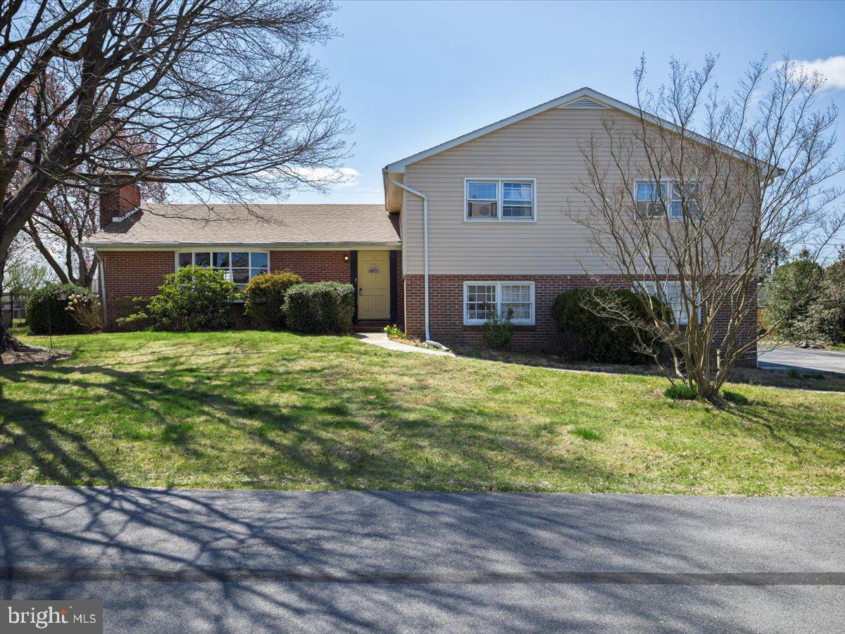 This split level home has lots of potential. Come add your personal touch. Home has real hardwood floors, primary bedroom with full bath and walk in closet, family room on lower level, separate laundry room, kitchen with breakfast nook and separate dining room. Living room offers wood burning fireplace and build in bookshelves as well as a large bay window. Large concrete patio out back is perfect for hanging out with friends.