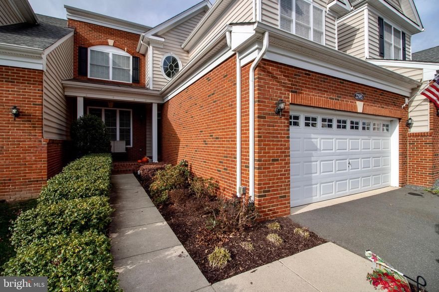 Welcome home to Loudoun Valley Estates! This gorgeous townhome features over finished 3400 sq ft of beauty! The primary bedroom is on the main level and boasts vaulted ceilings, walk-in closet and spacious bathroom with dual sinks and a huge shower. Hardwoods throughout the entire main floor, including the bedroom! This home is perfect for entertaining with a separate formal dining room and living room, in addition to open kitchen and family room with two story ceilings and cozy gas fireplace! The kitchen features an elegant backsplash, granite countertops, center island, stainless steel appliances, and gas cooking, as well as  table space. The main level is finished off with laundry room featuring front-loading washer and dryer and a half bath for guests. Upstairs are two spacious bedrooms and two full bathrooms, another walk-in closet and open loft space. The walk-out basement is fully finished and features a fourth full bathroom! The backyard is completely fenced in and the stamped concrete patio is begging for BBQs! The two car garage and driveway provide ample parking for residents and guests - rare in a townhome community!