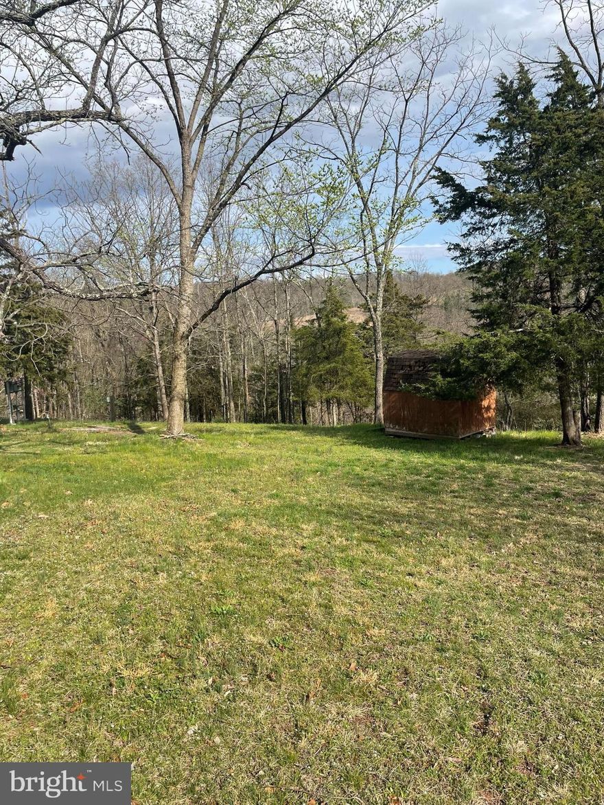 Own your own piece of West Virginia, Wild and Wonderful! Two+ acre lot on a ridge with views all around. About an acre of flat, usable land and another acre of wooded hunting land. See aerial photo to get a sense of proportions. Property has electrical service and has been used for an RV for vacations and hunting.