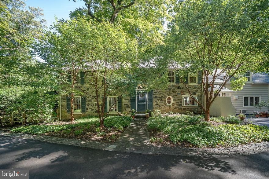 Welcome to 110 Anton Road! Perched high above the street in the most private, bucolic woodland
setting ever, yet walkable to everything! Classic and elegant 5 bedroom stone Colonial, comfortable and
inviting. Beautiful architectural details give this house character that sets it apart from other Main Line
homes. Inviting 2-story center hall entry with rounded stairway and adjacent library. Gracious formal
living room with wood-burning fireplace opens to a fieldstone patio with views into the woods.  Formal
dining room opens to another fieldstone patio. Updated kitchen with granite countertops and breakfast
nook, fabulous 2-story family room overlooking the beautiful and very private in-ground pool. A great
home office and two powder rooms complete the first floor. The basement is spacious, dry and features
a finished room with fireplace for billards, exercise or hobbies. 

The primary bedroom suite features a beautiful bathroom, spacious storage and a private balcony with
beautiful views for peaceful morning coffee or just a bit of peace and quiet . Four additional bedrooms and three additional full bathrooms complete the second floor. So much storage in this house! Attached ample sized 2-car garage features an adjacent utility room for gardening and storage.  This amazing Northside Wynnewood home sits on an acre of beautiful woodland with landscaped gardens and rolling lawn. 

Well loved and meticulously maintained. Quiet private cul de sac location just ¾ of a mile to
Suburban Square and less than a mile to the Ardmore Train Station with both SEPTA and Amtrak service.  Award-winning Lower Merion schools and CHOICE of Lower Merion High School or Harriton High School.