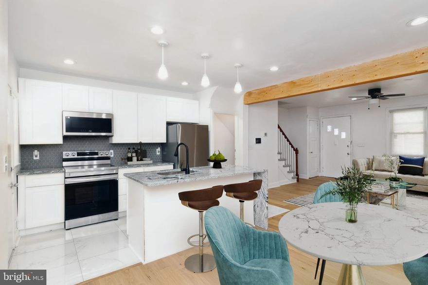 *PRICE DROP* Welcome to this beautifully renovated home in Baltimore, just minutes away from downtown inner harbor and the suburb of Baltimore County. This charming property features, three bedrooms with ceiling fans and plenty of natural light and two full bathrooms updated with modern features. Enjoy a gourmet kitchen boasting marble countertops, stainless steel appliances, breakfast bar, and ample cabinet space. The home also features new stylish laminate floors on the open main level and basement, and plush new carpet on the upper level. The fully finished basement is perfect for a family room, home office, or entertainment space. Enjoy the front and back porches, ideal for relaxing and entertaining. Convenient off-street parking in the back. Brand new roof, utilities, sump pump, and fixtures. Don't miss the opportunity to own this affordable, move in ready gem!