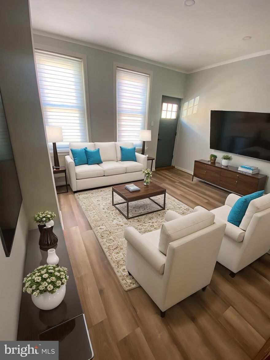 Step into luxury starting with high ceilings in this lovely finished basement rec room oasis with an additional room in the rear for office or possible 3rd bedroom complete with a state of the art half bath.  The first floor has new ceilings and walls exquisitely done to go with the perfect brand new vinyl floors, a fantastic modern design. There is an extension of the living room that can be used as a dining room that flows into a huge modern eat-in kitchen with 3 year old cabinets, brand new stone counter and stainless still sink, new stainless steel refrigerator and stove with plenty of room for a table. You won't be disappointed in this spacious rear yard perfectly situated at the end of the row. Of course there are all new light fixtures, custom window treatments and a brand new state of the art EPDM roof with life expectancy of 30 years. The heater is 8 years new as well.  The 2nd floor besides having the same brand new flooring, walls and ceiling as the first floor in its 2 great size bedrooms and a  brand new full size bath.