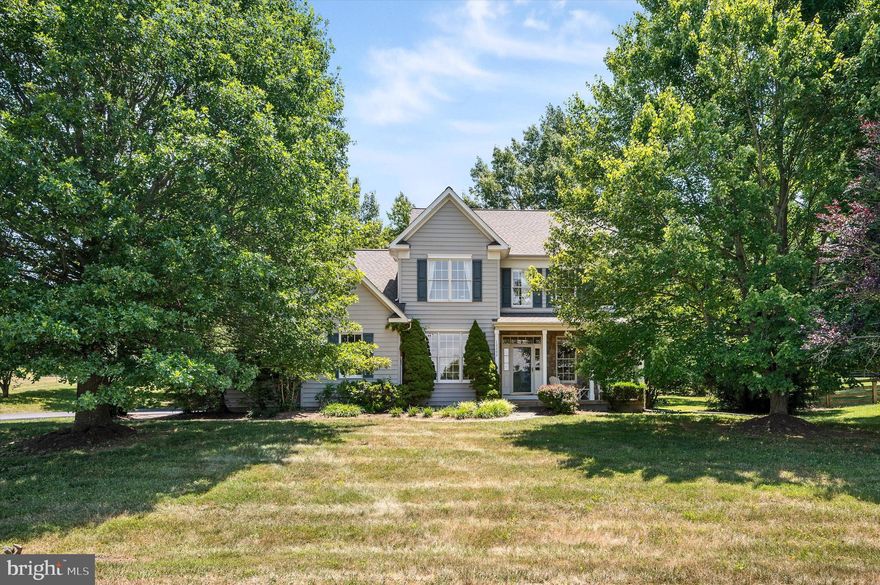 Beautiful home and setting in Dobbins Creek Hamlet in Lovettsville. Small community with 45 acres of open conservancy space for unique setting next to the town of Lovettsville. Walk to the new grocery store, shops, restaurants, gym, community center and more. Small town feel in the Virginia Countryside. Beautifully landscaped one acre lot with mature trees and plantings. Patio** Stone accents and fireplace. Very private on dead end street and open space area. The views of the mountains and amazing nightly sunsets from your front porch. Re-paved driveway to 2 car side load garage. Interior of garage just painted. This beautiful home inside features 4 bedrooms, 3.5 bathrooms and appx 3674 finished square feet. Refinished hardwood floors entire main level. Home office with Comcast for internet needs. Wood burning fireplace in family room. New SS appliances, granite counters and undermount sink new May 2024. Separate dining room and also table space in kitchen. New carpeting upper level. Huge walk-in closet in large primary bedroom and separate shower and soaking tub. Amazing views to the mountains and private backyard. Two-zone HVAC.