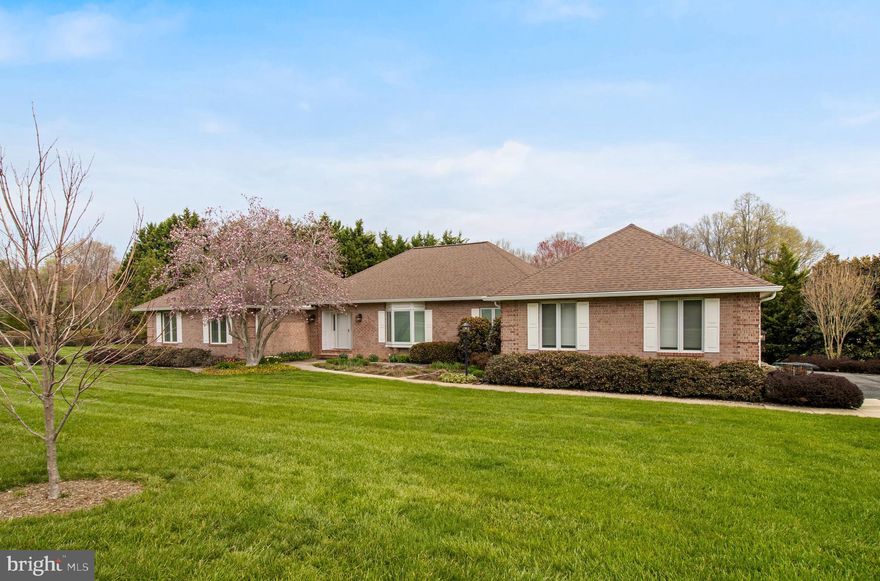 Welcome to one of the most impeccably maintained brick-front homes you’ll ever encounter - where pride of ownership is evident at every turn, inside and out. The exterior is nothing short of exceptional, featuring thoughtfully designed stone hardscaping throughout, lush and meticulously cared-for lawn, and mature trees that create a private, serene setting. A charming front courtyard offers a warm and inviting entrance, while the expansive newer deck stretches across the rear of the home. Step inside to a grand foyer accented by stunning hardwood floors and 9-foot ceilings adorned with crown molding throughout. The front living room is filled with natural light from a beautiful bay window, while the spacious great room showcases a striking fireplace with a stone surround. The kitchen, opening seamlessly to the breakfast area and sunroom with vaulted ceilings, is the perfect place to gather. It features white cabinetry, granite countertops, tile backsplash, stainless steel appliances, pantry cabinets, and under-cabinet lighting and more! Additional main-level highlights include a private office with plantation shutters and custom built-ins, along with direct access to the backyard. A convenient half bath with a pocket door, a generously sized laundry room with built-in cabinetry, and a dedicated closet housing the whole-house water filtration system. On the opposite side of the home, you’ll find three bedrooms with the potential for a fourth. The expansive owner’s suite offers a versatile sitting room (easily converted into an additional bedroom) along with a walk-in closet and a luxurious ensuite bath featuring a soaking tub and glass-enclosed walk-in shower. Notable updates include: washer & dryer (2026), kitchen wall oven (2025), deck and stairs (2023), and roof and gutters (2022). This is a rare opportunity to own a home that has been truly cared for in every detail - inside and out.