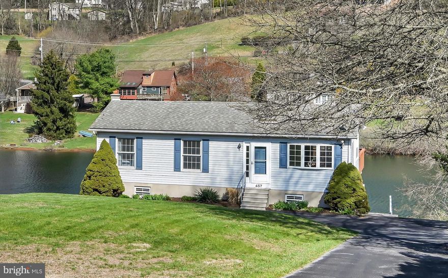 **New Listing — Lakefront Living on Fawn Lake**
Welcome to your dream retreat — a move-in ready, meticulously cared-for 3-bedroom, 2-bathroom 2,050 square foot home nestled on 0.4 acres of pristine lakefront property. Bright, clean, and brimming with character, this gem offers gorgeous sunset views and an easy stroll to the crystal clear waterfront. Step inside to a vaulted living room that creates an airy, open atmosphere, flowing effortlessly into the dining area and well-appointed kitchen — perfect for entertaining or quiet evenings at home.  3 bedrooms and an updated bathroom grace the main floor. The spacious basement is brimming with potential, ready for your personal vision. A family room and an additional bathroom plus laundry area and workshop space accommodate family and guests alike. Notable, functional features include Andersen sliding doors, two mini-split systems for efficient year-round heating and cooling, paved driveway, and on-site septic. Outside, the appeal continues. A large deck with superior views, stamped concrete patio, extensive hardscape with retaining walls, storage under the deck, a shed, and a floating dock enhance this property's outdoor living space. Fawn Lake is a private, 27-acre gem known as the "Little Lake" — specializing in non-motorized and electric-only boating, swimming, and fishing. With 45-foot depths, a dedicated boat launch, pavilion, and serene non-wake atmosphere, tranquility is guaranteed. The dam/spillway was repaired in 2009, and this lake is functioning at full pool. Located within the gated Lake Wynonah community, residents enjoy 1,476 acres of rolling hills, 27 miles of paved roads, a community pool, lodge, and crystal-clear waters. This is lakefront living at its finest.