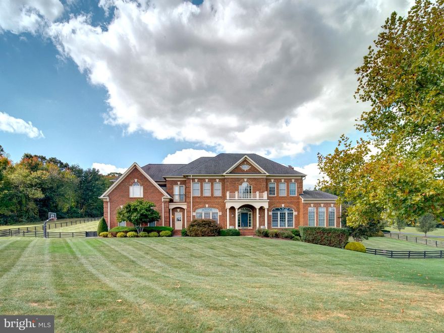 Welcome to your dream oasis, uniquely nestled in one of the Loudoun’s prime communities. This breathtaking property spans an impressive 3 acres offering serene panoramic views of rolling hills that paint a stunning backdrop to everyday life. Designed with elegance and dramatic flair this Renaissance Grand Michaelangelo reflects luxury and sophistication. As you approach the all-brick facade, you are immediately greeted by stylish accents and unique trim that set the tone for what lies within. Step inside to discover a soaring main floor with gorgeous wood floors that flow throughout, leading you into the heart of the home. The magnificent spiral staircase commands attention and serves as a stunning architectural centerpiece, inviting all who enter to experience the grandeur this home offers.
Culinary enthusiasts will fall in love with the gourmet kitchen, outfitted with designer appliances that make entertaining a breeze. The spacious layout ensures that guests can gather, as meals are prepared in style. Whether hosting a dinner party or enjoying a quiet family meal, the large windows show off the panoramic rear landscape and resort like amenities. The grand master suite with 4 closets, private office and large spa like lux bath is a true retreat, boasting ample space and luxury amenities that offer a serene escape at the end of the day.  With a total of 5 bedrooms, each with a private en-suite bath, there is no shortage of space for family and guests to feel at home. Venture down to the fully finished walkout lower level where you will find a designer basement that redefines relaxation and entertainment. This versatile space is perfect for movie nights, family gatherings, or hosting friends for the big game.
Step outside into your private resort-like backyard, where tranquility and luxury collide. The infinity edge pool beckons on warm sunny days, while the adjacent pool house, complete with a cozy fireplace and bar, sets the stage for unforgettable summer nights spent under the stars. This home is more than just a property... it’s a lifestyle. With its unique details, sophisticated design, 4 car garage and prime location, it offers not just a place to live, but a sanctuary to thrive. Don’t miss your chance to own this extraordinary masterpiece. Located 10 Minutes from Downtown Leesburg and Brambleton Town Center and just 15 Minutes from Dulles Airport.  Schedule your private tour today and let your dreams take flight in this exquisite residence.