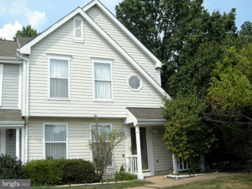 Lovely villa style end unit townhouse located close to Wegmans, shopping and major transportation routes.  Backs to woods and common area.  Adjacent to Wo&D bike trail.  Gleaming wood floors, custom paint, crown molding, 6 panel doors, bright sunny family room and living/dining room.  Fenced yard. Lg deck.  Excellent price for 3 BR/ 2 BA home in excellent area at end of cul de sac. Lots of storage