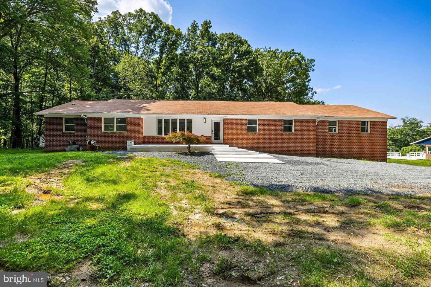 Newly remodeled 4BR/2.5BA Rancher with a 2BR/2BA newly remodeled detached pool house located on a sprawling lot in Monkton. Park just steps from the two-car garage, and make your way to the main house offering a large front porch and the entry into your new home. Step inside a home filled with tons of natural light, an open concept floor plan, recessed lighting, glamorous light fixtures, vaulted ceilings, luxury flooring, and a soft color palette. The main living space consists of an oversized living room and dining room with a brick wood burning fireplace, a breakfast nook, and a gorgeous kitchen. The kitchen offers plenty of cabinets, sleek quartz countertops, stainless steel appliances including a slide-in gas range set under a large picture window, and a deep stainless sink set into an island with waterfall edges, luxury pendant lights, and breakfast seating for the entire family. Just off the kitchen is the laundry/mudroom and access to the yard. Down the hall is a half bath, two sizable secondary bedrooms, one offering a full bath, and a large primary suite. The primary is stunning boasting custom vaulted ceilings, not one, but two large walk-in closets, and a stunning en-suite featuring a floating double sink vanity, a large walk-in shower with double rain shower heads, and a large soaking tub. The lower level is semi-finished offering additional living space including the fourth bedroom, storage, access to the two-car garage, plenty of storage, and rough-in plumbing for a bath in the future. From the dining room, step outside to a wood deck that overlooks a yard filled with green space and tons of possibilities. The separate 2BR/2BA pool house has also been completely remodeled and is just steps from the main house. The pool house features laundry, a kitchen, two spacious bedrooms, two newly remodeled full baths, and from the large family room sliding doors to a large deck that leads to a spectacular inground pool. Both these homes are move-in ready with so much to offer new homeowners, and are located in close proximity to shopping, restaurants, and commuter routes.