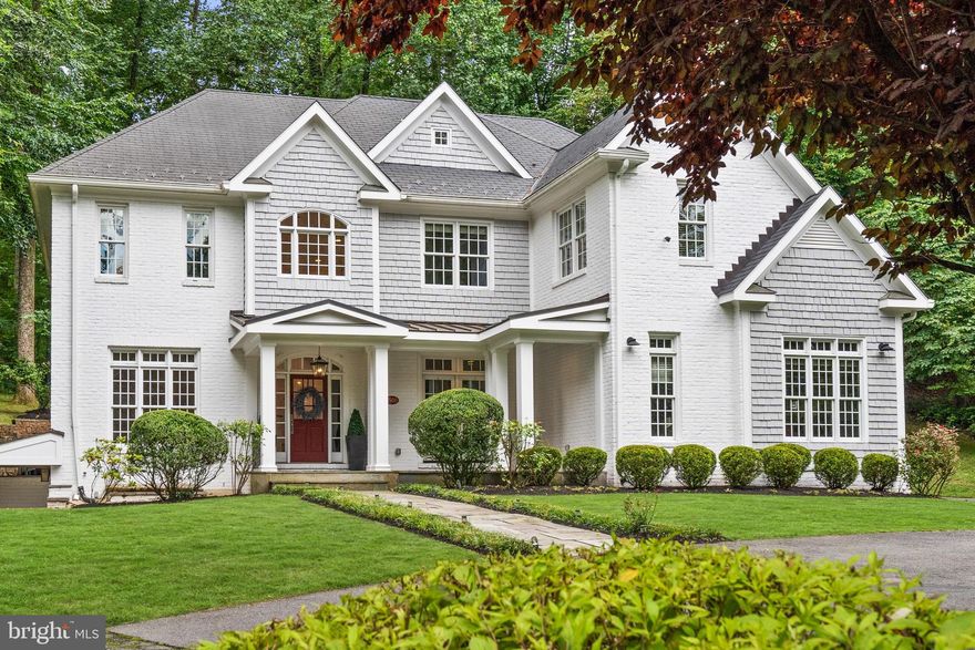 Incredible Value! Introducing 7500 Nevis Road—a custom-built, newly-updated colonial masterpiece, ideally situated in the heart of Bethesda's Bannockburn Estates. This home epitomizes the best in single-family living, offering a harmonious blend of expansive square footage, lavish craftsmanship, ultimate privacy, and a prime location. Set against a lush, wooded backdrop, the freshly painted white-brick and gray-shingle facade complements the natural surroundings. A flagstone pathway, winding through manicured lawns, leads to a covered entrance that opens to a breathtaking double-height foyer, anchored by an elegant grand staircase.

The main level, boasting soaring ceilings, is thoughtfully designed to facilitate both large-scale entertaining and intimate daily life. The open floor plan ensures seamless flow between formal and informal spaces, punctuated by designer fixtures from Restoration Hardware. At the core of the main level, the kitchen—equipped with Viking appliances, Venezia Quartz and Calacatta Vagli countertops, and premium Schaub and Company hardware—stands as a testament to luxurious yet functional design. A secluded bedroom suite enhances the home's multigenerational adaptability, while a mudroom provides direct access to a three-car garage.

Upstairs, the primary suite is a sanctuary, occupying its own wing and featuring a separate sitting area and a private balcony. A newly renovated, spa-like bath and a spacious walk-in closet with custom shelving complete this luxurious retreat. Three additional bedrooms and two baths offer ample space, while a versatile room can serve as a family room, home gym, or expansive office. The lower level is an entertainer's dream, featuring a fully-tiled recreation room, game room, and wet bar—all designed for open, flowing interaction. A bonus room and an additional bedroom suite add another layer of functionality to an already brilliantly designed floor plan. Outside, a spacious flagstone patio opens to a tranquil, wooded oasis sprawling over half an acre.Located in close proximity to key thoroughfares and the city, and belonging to the sought-after Whitman school cluster, 7500 Nevis Road stands as a property of unmatched distinction.