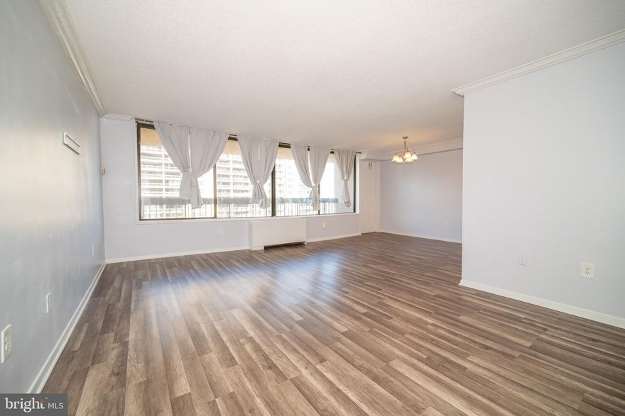 MONUMENT VIEWS! Welcome to Skyline Plaza, where convenience meets comfort. This spacious 2-bedroom, 2-bath condo offers light-filled living with wide open views from its expansive balcony, perfect for morning coffee or evening sunsets. Inside, wood floors flow through the bright, open spaces, creating a warm and inviting backdrop for daily living and entertaining.

The primary suite features generous closet space and an en suite bath, while the second bedroom easily doubles as a guest room or home office.  Large windows bring in natural light throughout, making the home feel airy and uplifting.

At Skyline Plaza, amenities and services abound, from the pool and fitness center to 24-hour concierge, on-site shops, and garage parking. All of this in a location that couldn’t be more convenient: moments to Arlington, Alexandria, the Pentagon, and DC, plus easy access to I-395, Metrobus, and nearby shopping and dining.