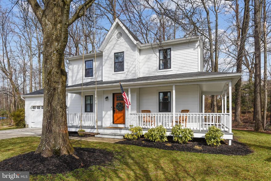 Welcome home to this alluring three-level colonial upgraded to the most beautiful modern farmhouse in the sought after community of Blackwalnut Cove in Annapolis! You'll be captivated by the open concept, dazzling new kitchen complete with custom cabinetry, quartzite countertops, LG appliances, white subway tile and open to dining and family room. The main level also boasts gorgeous refinished hardwood flooring, a floor to ceiling white-washed brick fireplace, half bath with laundry closet, and access to a large two car garage. Rear sliders lead to a stone patio in a private backyard backing to trees. The upper level of this home boasts new carpet throughout, three bedrooms that includes a primary suite with separate tub/shower and walk-in closet. New Pella windows installed in 2018. Nestled on a cul-de-sac and in walking distance to two community parks where you can store and launch a canoe/kayak, enjoy gazebos, basketball courts, and a tot lot playground with train.