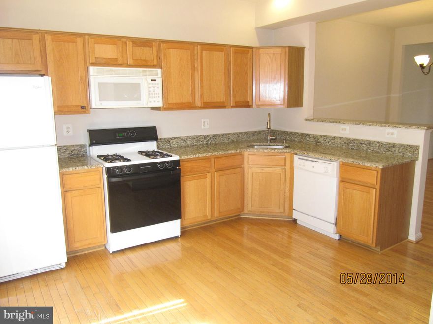 Adjusted Price! Beautiful 3 level townhouse with hardwood floors throughout the main level, Fresh paint,Fresh cleaned carpets,fresh stained deck and  off the kitchen. Finished lower level with Rec Room, additional Guest room/home office and walk-out to fenced in deck. A lot of storage and no yard work. You'll love the fabulous location!