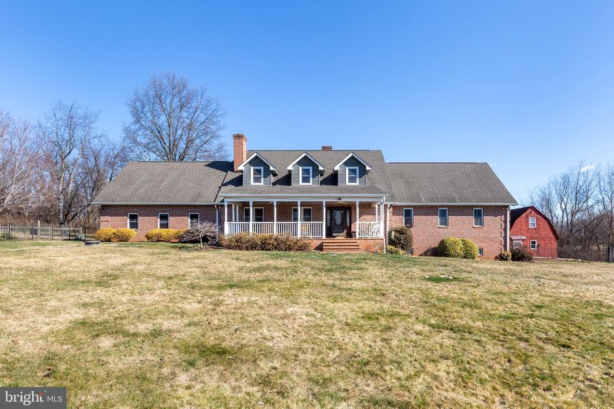 It isn't every day that a property like this becomes available! At the end of a mile long driveway, 27(+) acres offers privacy at its best. Here, a custom built all brick home with a huge, deep covered front porch faces a level fenced yard, beautiful pond, and trees galore. There's a pavilion ready for large summer cookouts. A gazebo, poised at the edge of the pond, is the perfect spot to relax and enjoy the sights and sounds of nature. A little way from the house is a separate huge garage with finished interior and storage upstairs. It's even heated and air conditioned. There's also a 6,000 sq. foot pole building with finished 14ft. ceilings and fully insulated walls finished with 3/4inch plywood. So many possibilities! When you're ready to end the day, home awaits. Prepare a home-cooked meal in the spacious gourmet kitchen featuring 2 convection wall ovens, an induction cooktop, granite counters, and bar height seating for three. When you're in need of more seating, move the meal to the dining room. There's so much space everyone can pull their chair out with ease and there's no worries about  a crowd! In the living room, a cozy wood burning fireplace is set among built-in shelves while the windows offer views of the front porch and pond. The first floor of this home features a primary suite sanctuary with large sitting area, 2 walk-in closets, and 2 bathrooms! No need to share! A doublewide staircase leads to the second floor with two additional bedrooms, yet another full bath, and storage galore. Don't let all this property has to offer get away. Request your private showing today.      *Property is being sold AS-IS