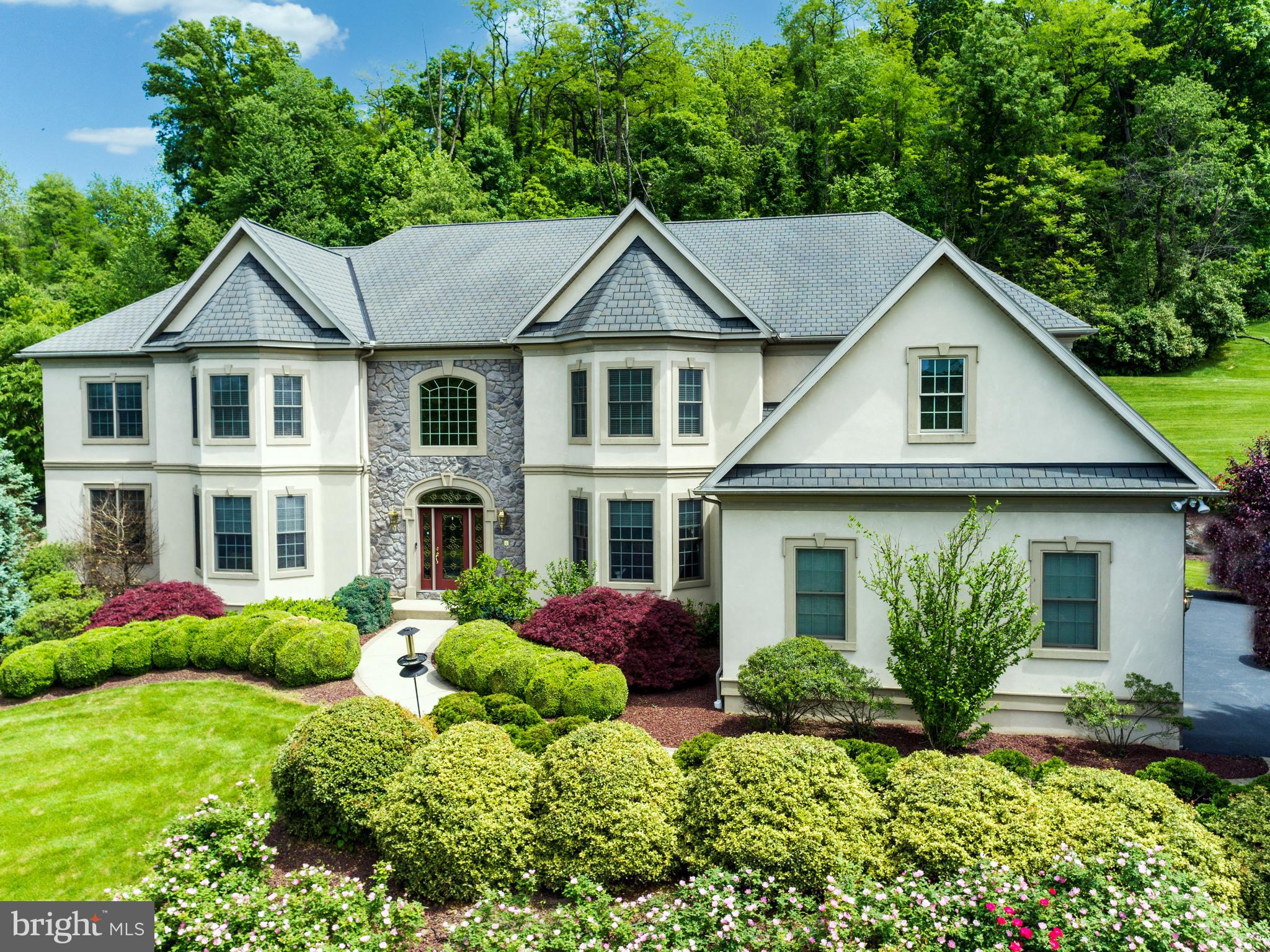Welcome to this magnificent home in Wilson Schools! Nestled within the prestigious gated community of
Inverness, this stunning residence greets you with a stately entrance that leads into a grand 2 story foyer
and an expansive open floor plan. Thoughtfully maintained and recently updated, the home will have a
stucco recertification, a new hot water heater installed at the end of 2023, a brand-new HVAC system in
2024, and a new roof added in July 2024.
The formal dining room is a showcase of elegance, boasting a tray ceiling, custom moldings, an exquisite
crystal chandelier, and beautiful hardwood floors that extend throughout much of the first floor. Adjacent
to the dining area, the formal living room is adorned with a coffered ceiling and flows seamlessly into a
bright and spacious sunroom which is an ideal space for entertaining guests.
Designed to impress, the immense custom kitchen opens to the family room and features high end
cabinetry, granite countertops, tiled backsplash, and both small and large islands with ample seating.
Equipped with premium stainless steel appliances, this gourmet space is a chef’s dream. The breakfast
room provides direct access to a private patio, surrounded by lush, professionally landscaped gardens.
Nearby, the sizable family room is anchored by a gas fireplace, framed by custom-built bookcases.
The first floor is further enhanced by a guest suite, a hall powder room, a versatile bonus room, and a
mudroom with convenient driveway access. An oversized 3 car garage, equipped with a ChargePoint car
charger, completes this level.
Upstairs, the expansive owner’s suite is a private retreat, featuring a sitting area, large custom walk-in
closets, and a dedicated home office. The en-suite bath is designed for relaxation, offering a whirlpool
tub, a tiled shower with custom showerheads, and dual sink built in vanity. The upper level also includes
2 additional bedroom suites with private full baths, 2 more bright and restful bedrooms with generous
closet space, and a shared dual bath. A loft area with built in desks and a secondary staircase leading to
the kitchen adds convenience and functionality.
The fully finished basement provides an abundance of additional living space, including a home theater
room, a bright daylight family room, a half bath, a workout area, and a spacious storage room.
This home is loaded with upgrades that enhance both comfort and convenience, including a fully
equipped home security system, a whole-home stereo system, a central vacuum, and an automatic
chandelier for effortless maintenance.
A true masterpiece of design and craftsmanship, this exceptional property offers luxury, style, and
modern amenities in an unbeatable location. Schedule your private showing today!