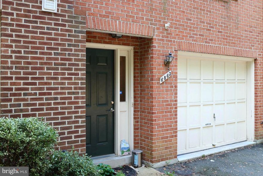 Charming, sun filled 2 bedroom, 2 1/2 bathroom brick townhome with garage in a fabulous location! Enjoy an open floor plan with gleaming hardwood floors, cozy fireplace in the  living room and adjoining dining area.  Kitchen  features pristine white cabinetry, gleaming granite countertops, and stainless steel appliances. Upstairs you'll find 2 bright and cheerful  bedrooms each with hardwood floors, walk in closets and  private baths! An oversize garage with generous storage and laundry space adds convenience. All this just steps away from plenty of shopping, dining and entertainment in every direction and just minutes to East Falls Church Metro, I-66 and Rt. 29.