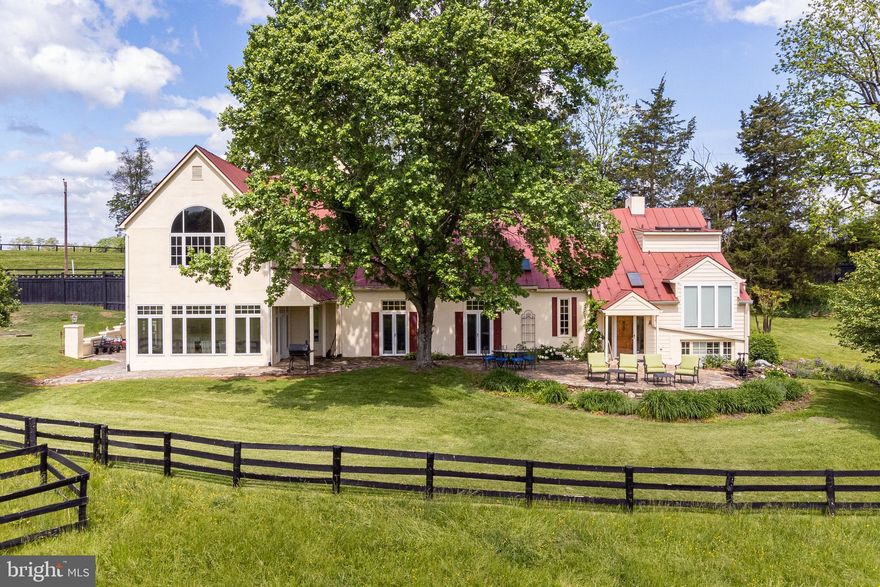 Ideally located minutes from The Plains and Middleburg, this 26-acre property offering has a large main residence, slate patios, pool, horse stable, detached garage, and several fenced paddocks.  The residence is an interesting blend of historic elements and modern additions creating a comfortable, yet charming mix of living spaces.   The original log cabin was constructed in 1763 and was composed of 3 rooms with the exposed beams and wood flooring still intact.  There was a later addition that expanded the home and created a generous sized great room perfect for entertaining and quiet enjoyment with a grand stone fireplace, high ceilings, and French doors leading to the patios.  On this side of the house there are 3 bedrooms each with their own private bathroom, the original formal dining room, separate office, and a galley kitchen.  The most recent addition was completed in 2003 and is light filled with an array of large windows surrounding the dining room and open to a gourmet kitchen with premium appliances, cabinetry, and countertops.  Off the kitchen, there is a full bathroom, laundry room, and mudroom with convenient access to the pool.  The upper level has a primary suite with pastoral views to the east, jacuzzi tub, and steam shower.  There is an additional bedroom off the primary for a total of 5 bedrooms.  With approximately 7,100 square feet and 2 kitchens, the house lends itself well to guest accommodations and entertaining.  The stable has 6 stalls, a tackroom with laundry, and a hay loft.  There is a detached garage suitable for collector cars or equipment and a large greenhouse.  The property has not been offered for sale in over 30 years, includes 3 parcels protected by a conservation easement, and cannot be sold separately.  Conveniently located in desirable Orange County hunt territory and minutes from Route 66.  Farm equipment including tractor, mower, and tools convey with the sale.