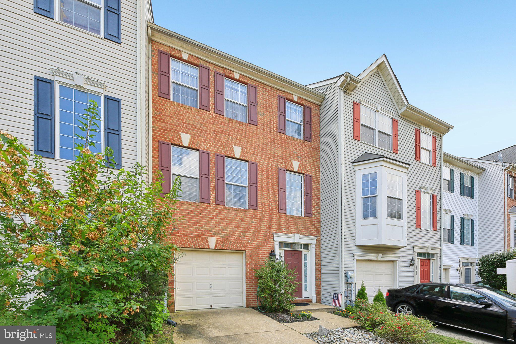 Welcome to 1017 Meandering Way, a stunning brick-front, three-level townhome located in the amenity-rich Piney Orchard community! This beautifully updated home offers 3 bedrooms, 2.5 bathrooms, and backs to serene woods for added privacy. The entry-level features a spacious recreation room with a cozy fireplace and walk-out to a private patio, along with luxury vinyl flooring that flows throughout the entry and main levels. The stylish kitchen boasts white cabinetry, an island, granite countertops, a decorative backsplash, and brand-new LG stainless steel appliances. Upstairs, the primary suite impresses with a vaulted ceiling and a remodeled spa-like bath complete with ceramic tile, dual sinks, a soaking tub, and a separate shower. Enjoy the convenience of being within walking distance to Gorc sports fields and all the incredible Piney Orchard amenities, including multiple outdoor pools, an indoor pool, a community center, fitness center, tennis courts, scenic trails, and several playgrounds. This home truly offers the perfect blend of comfort, upgrades, and lifestyle!